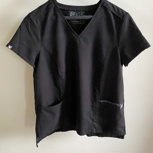 Figs Scrub top with camo pocket detail.